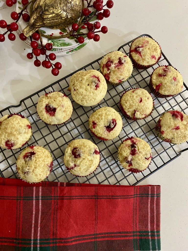 Freshly baked Cranberry Orange Muffins cooling on a wire rack